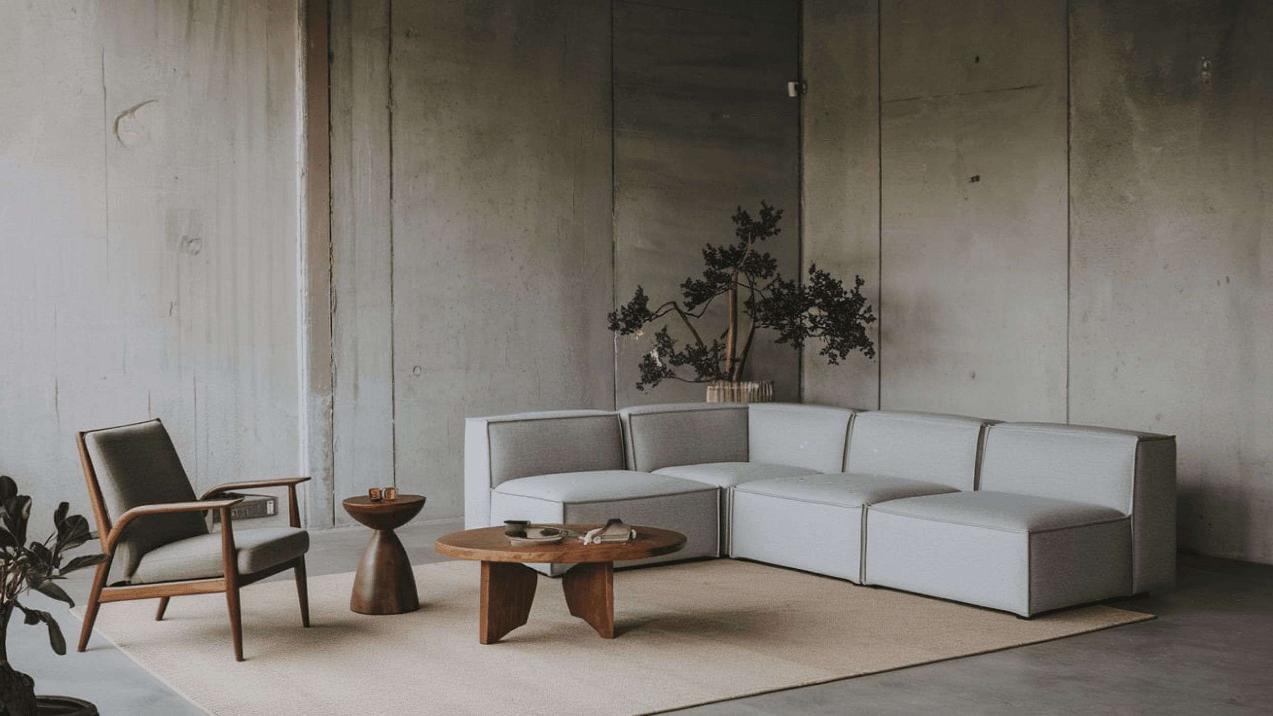 Living room with brown armchair and gray corner sofa