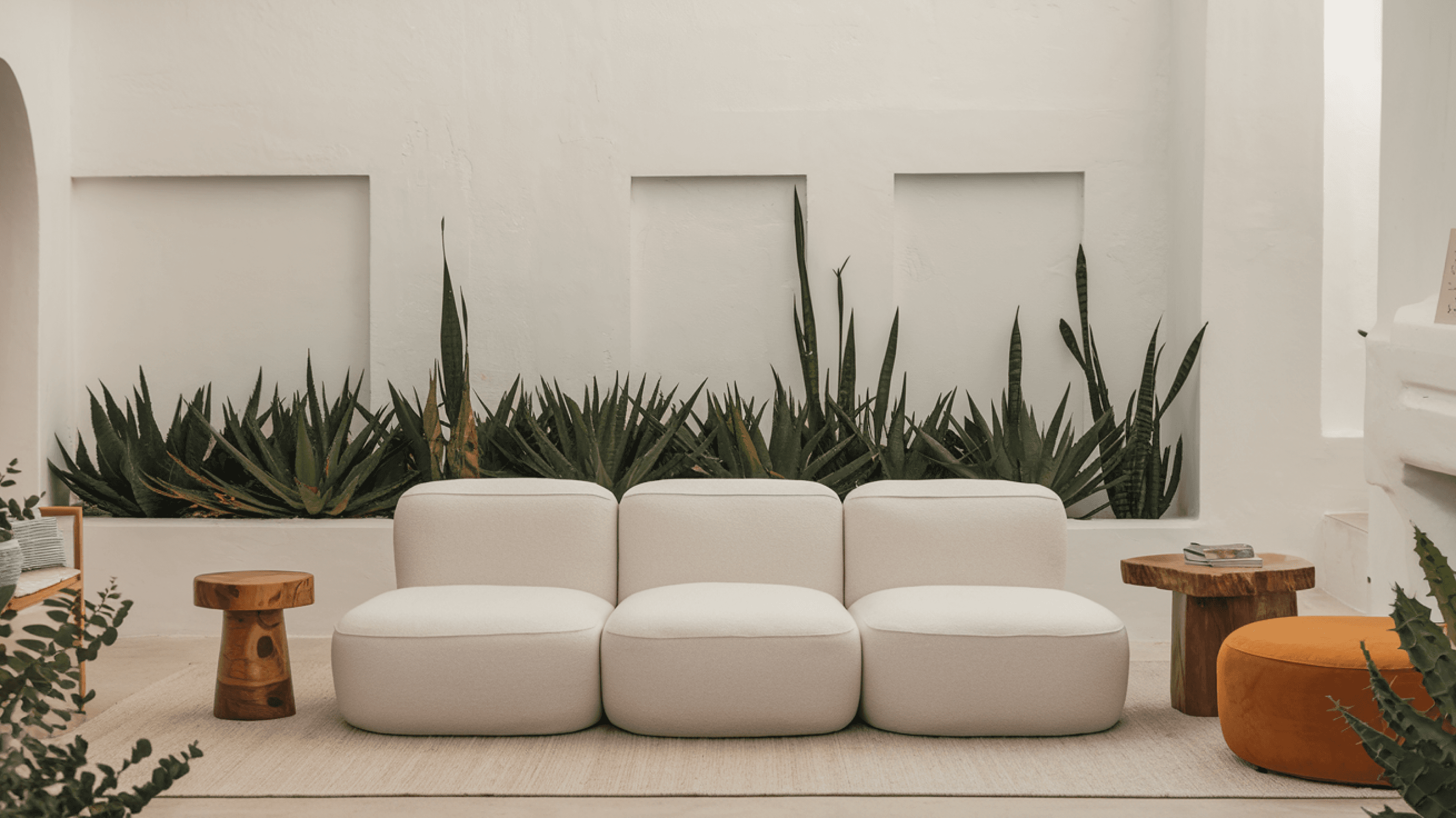 Living room with gray three-seater puffy sofa